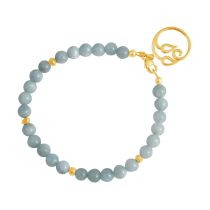 GEMSHINE Damenarmband aus hochwertig vergoldetem 925 Silber mit YOGA Lotusblume und Aquamarinen